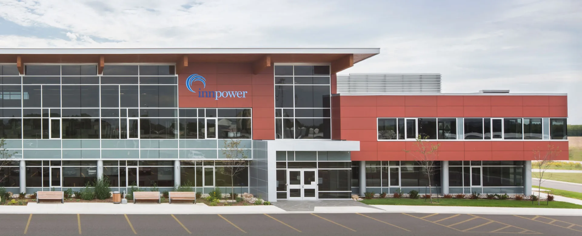 InnPower's head office, a two-storey red brick and glass building with the InnPower logo